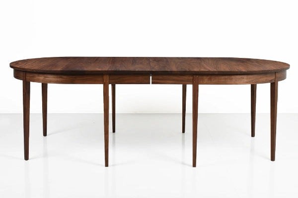 Wooden dining table on a white background