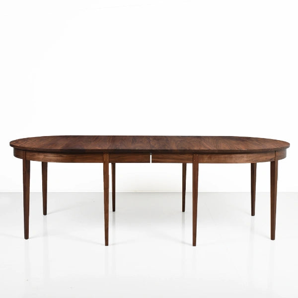 Wooden dining table on a white background