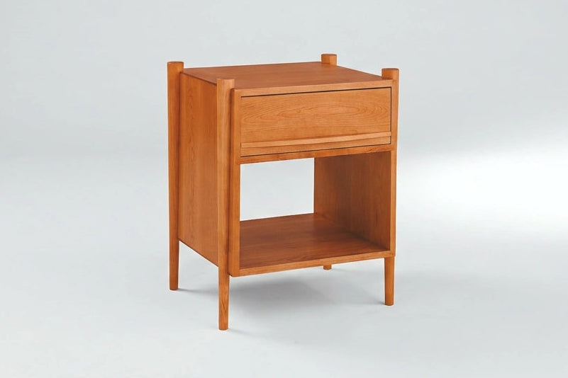 Wooden nightstand with a drawer on a white background