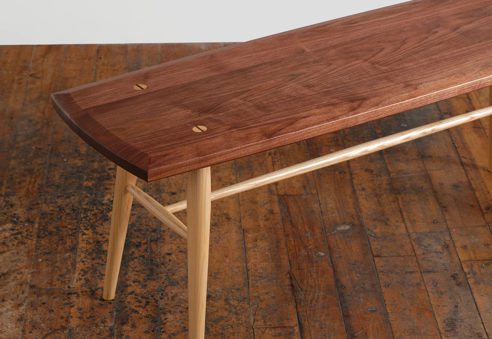 Wooden bench with a rustic wooden floor background