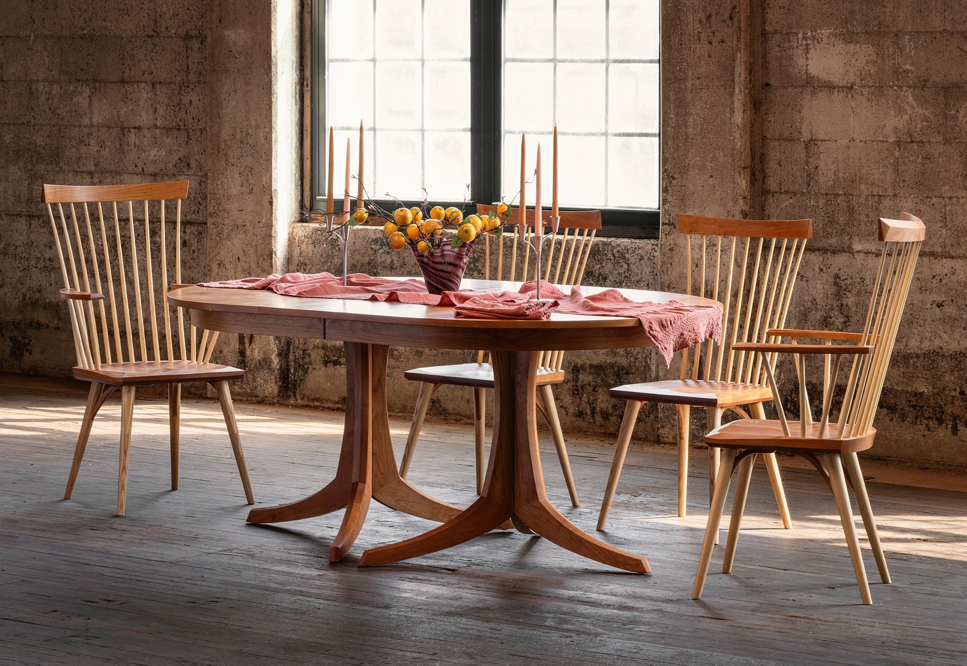 Wooden dining table with chairs in a rustic setting