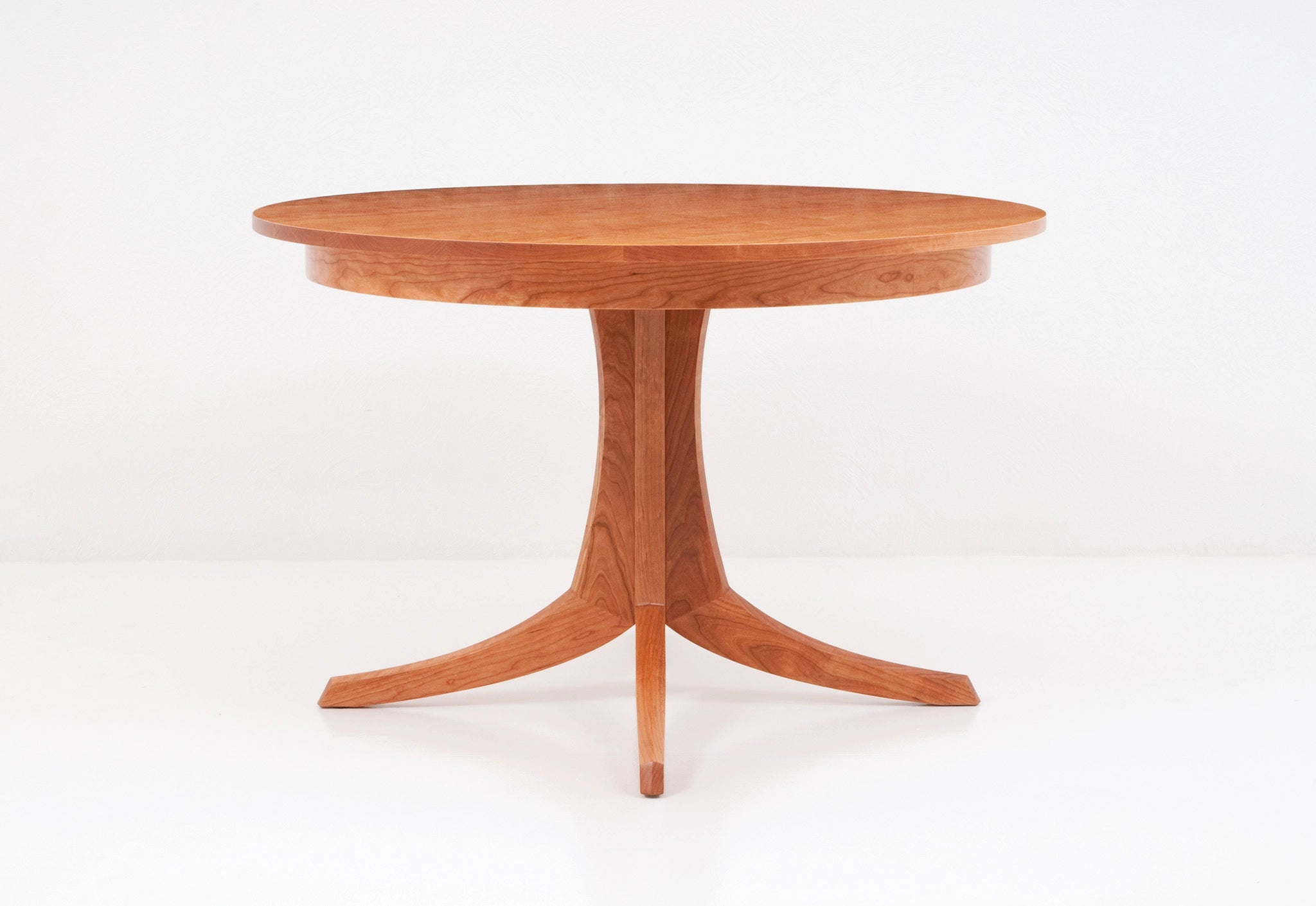 Wooden round table on a white background