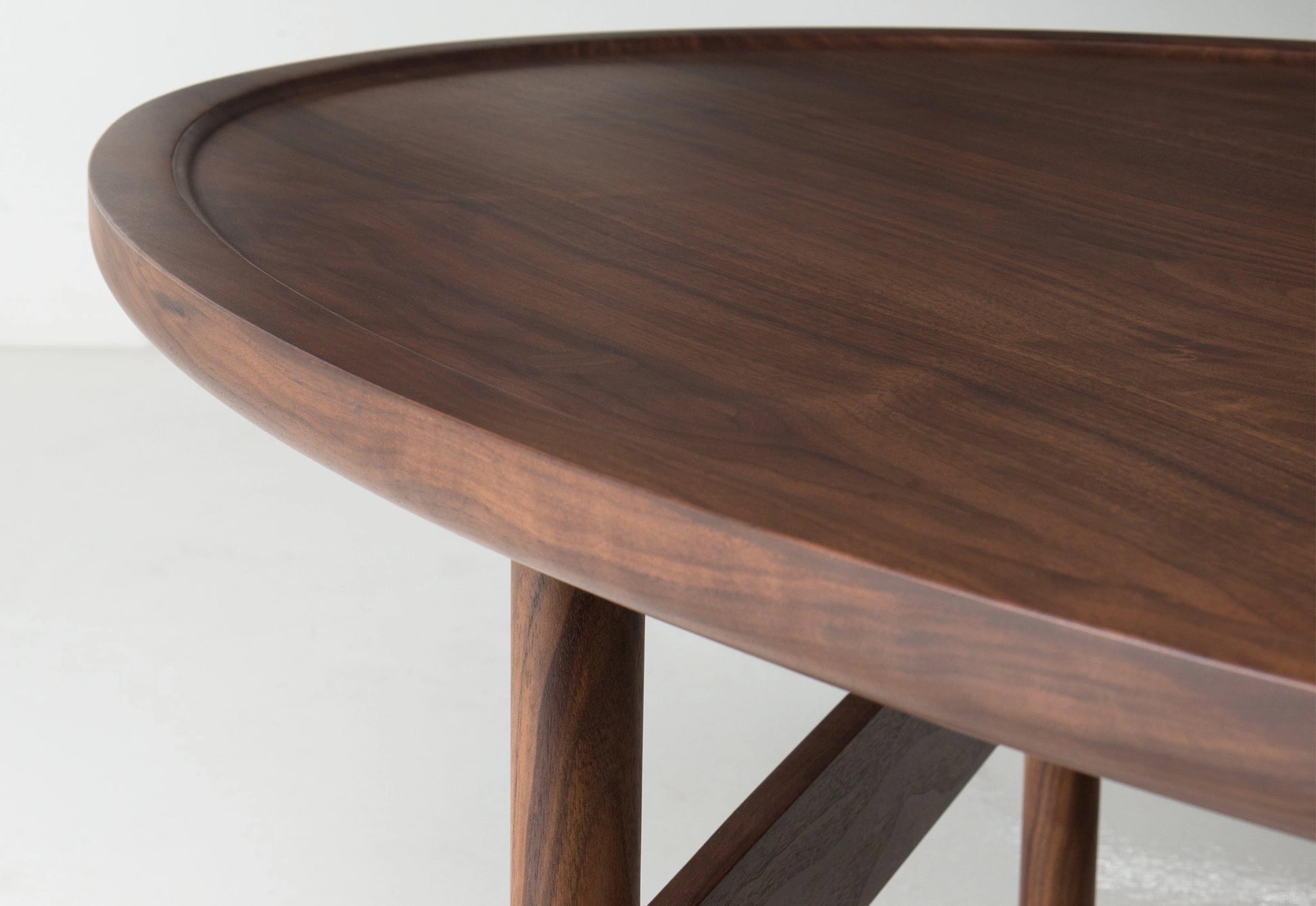 Wooden table with a dark finish on a white background