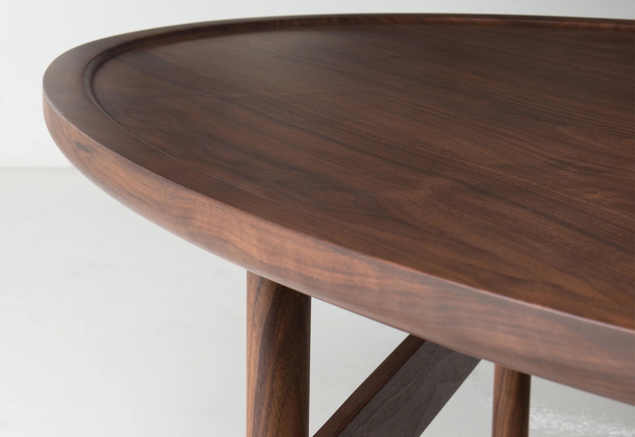 Wooden table with a dark finish on a white background