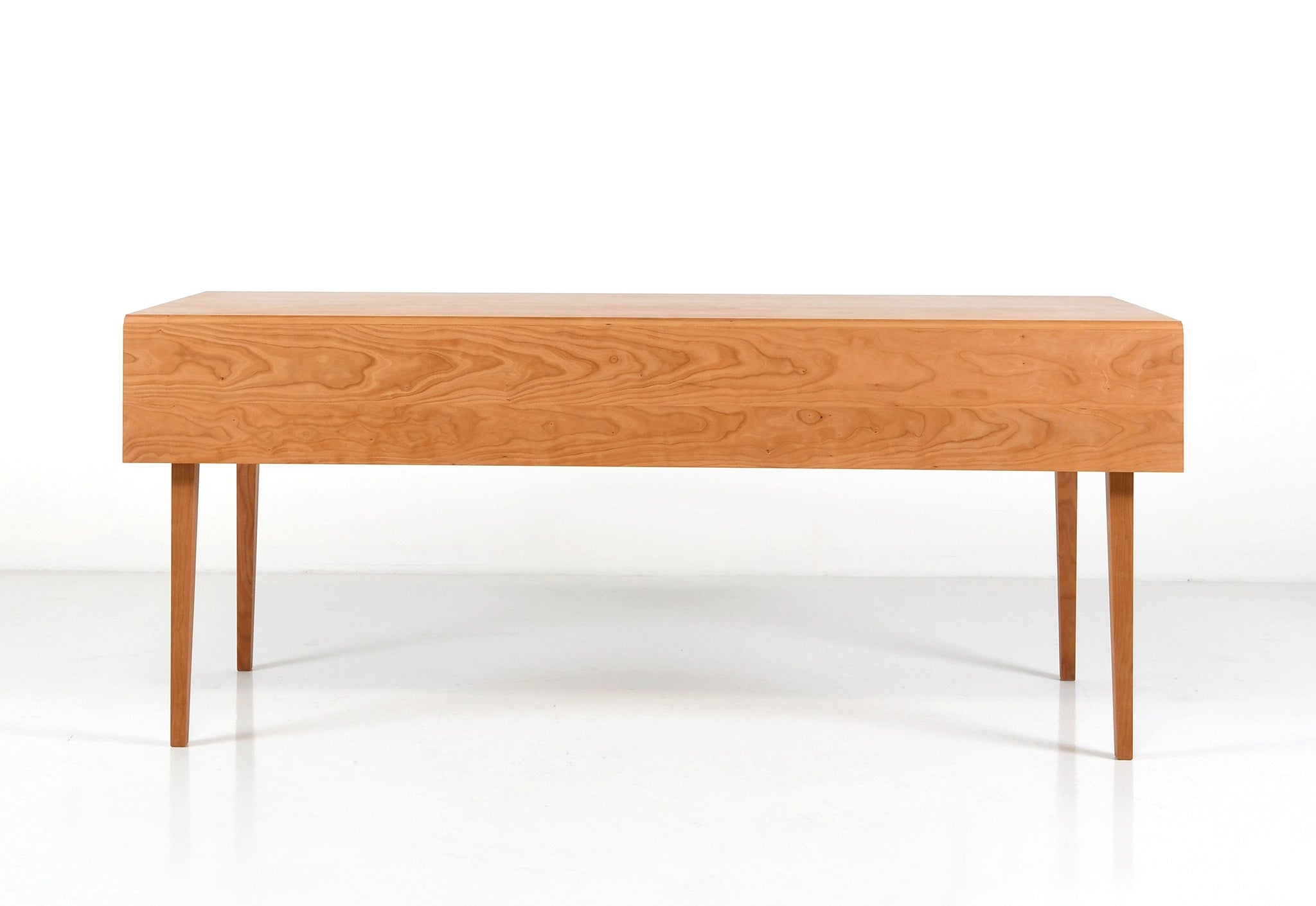 Wooden desk with a single drawer on a white background