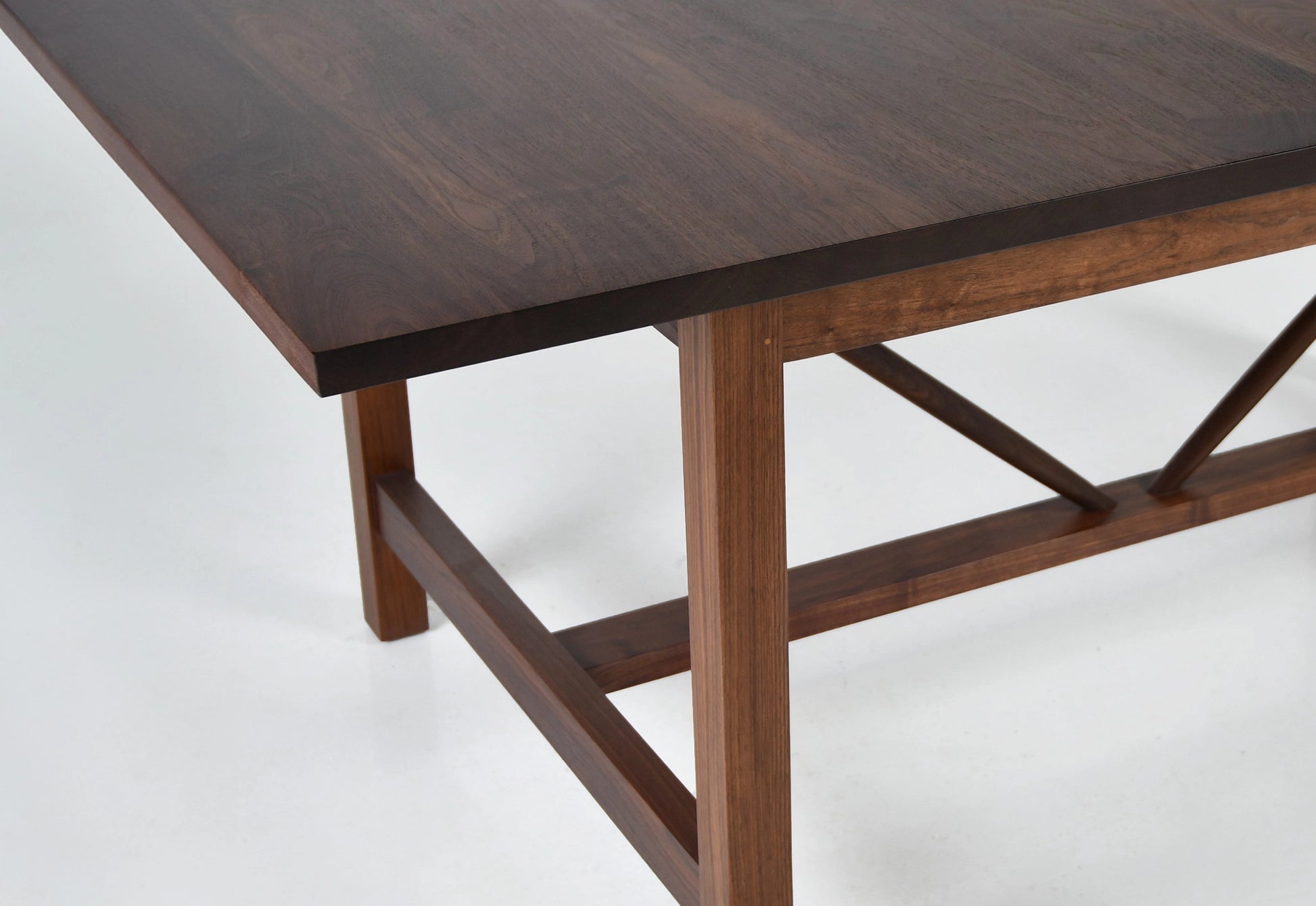 Wooden table with a dark brown finish on a white background