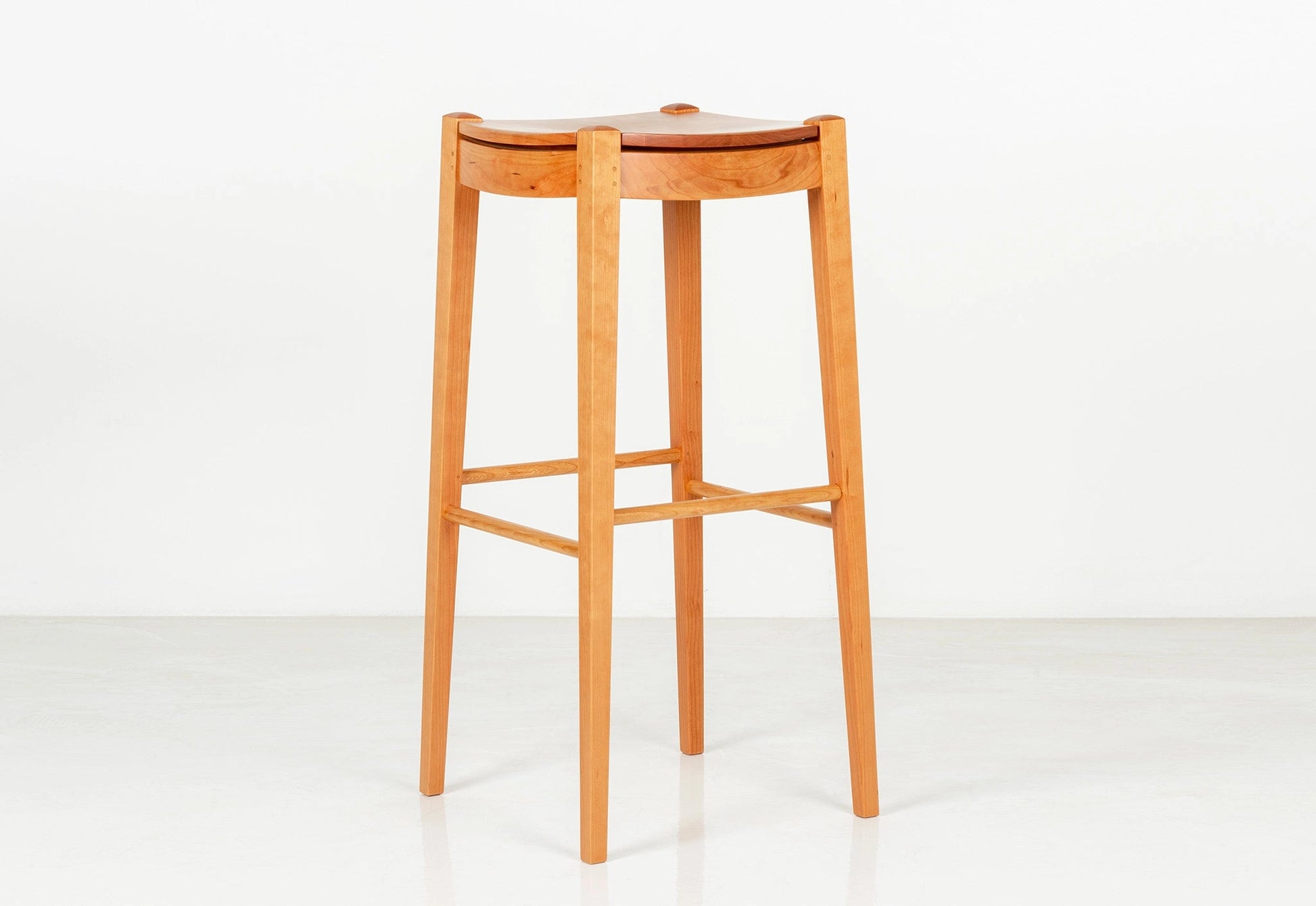 Wooden bar stool on a white background