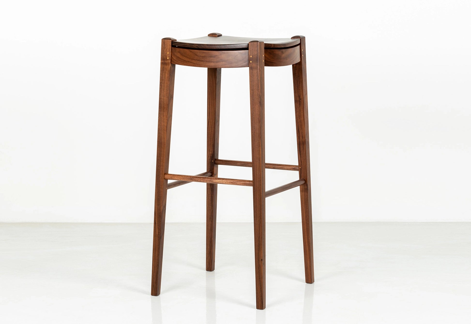 Wooden bar stool on a white background