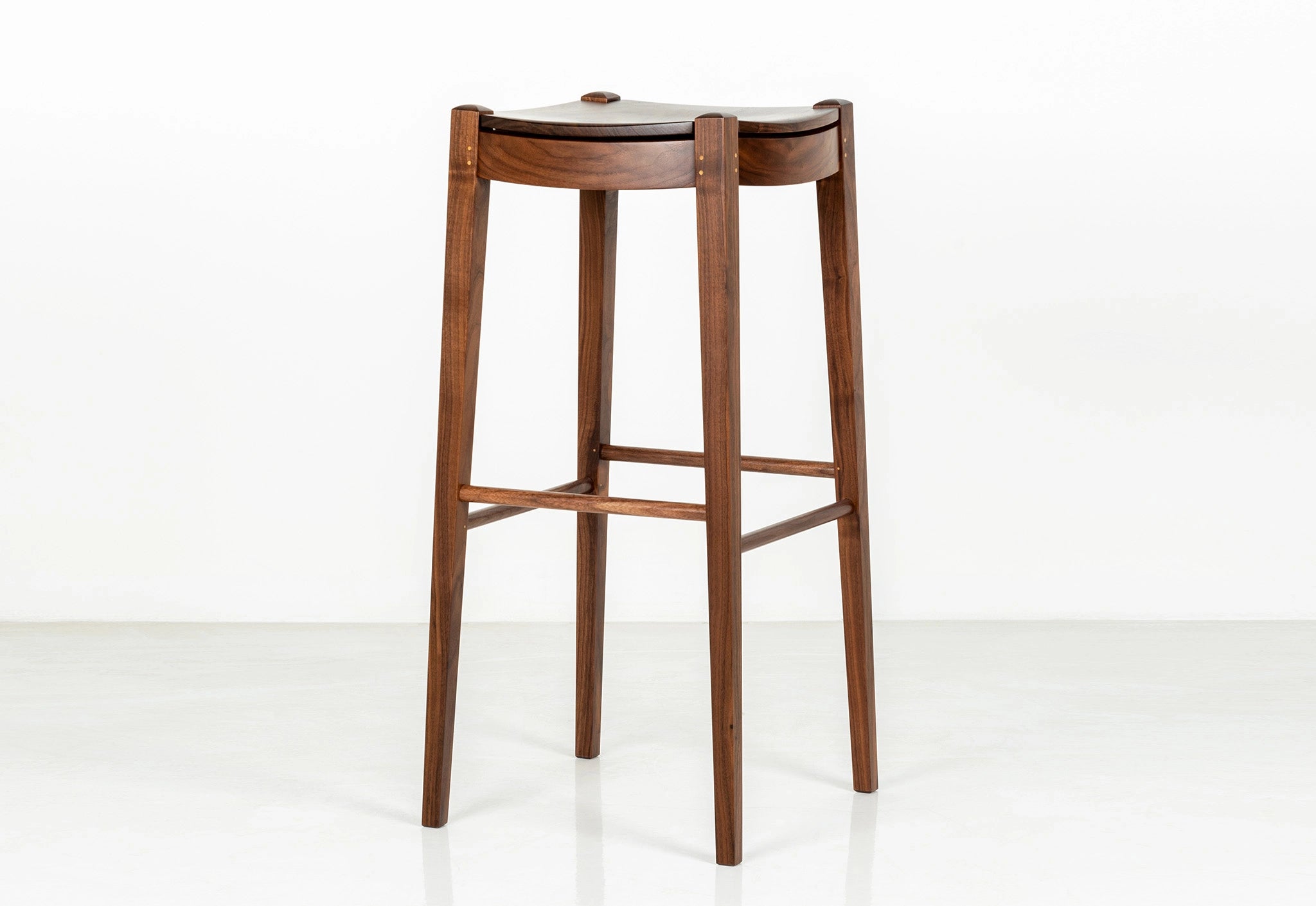 Wooden bar stool on a white background