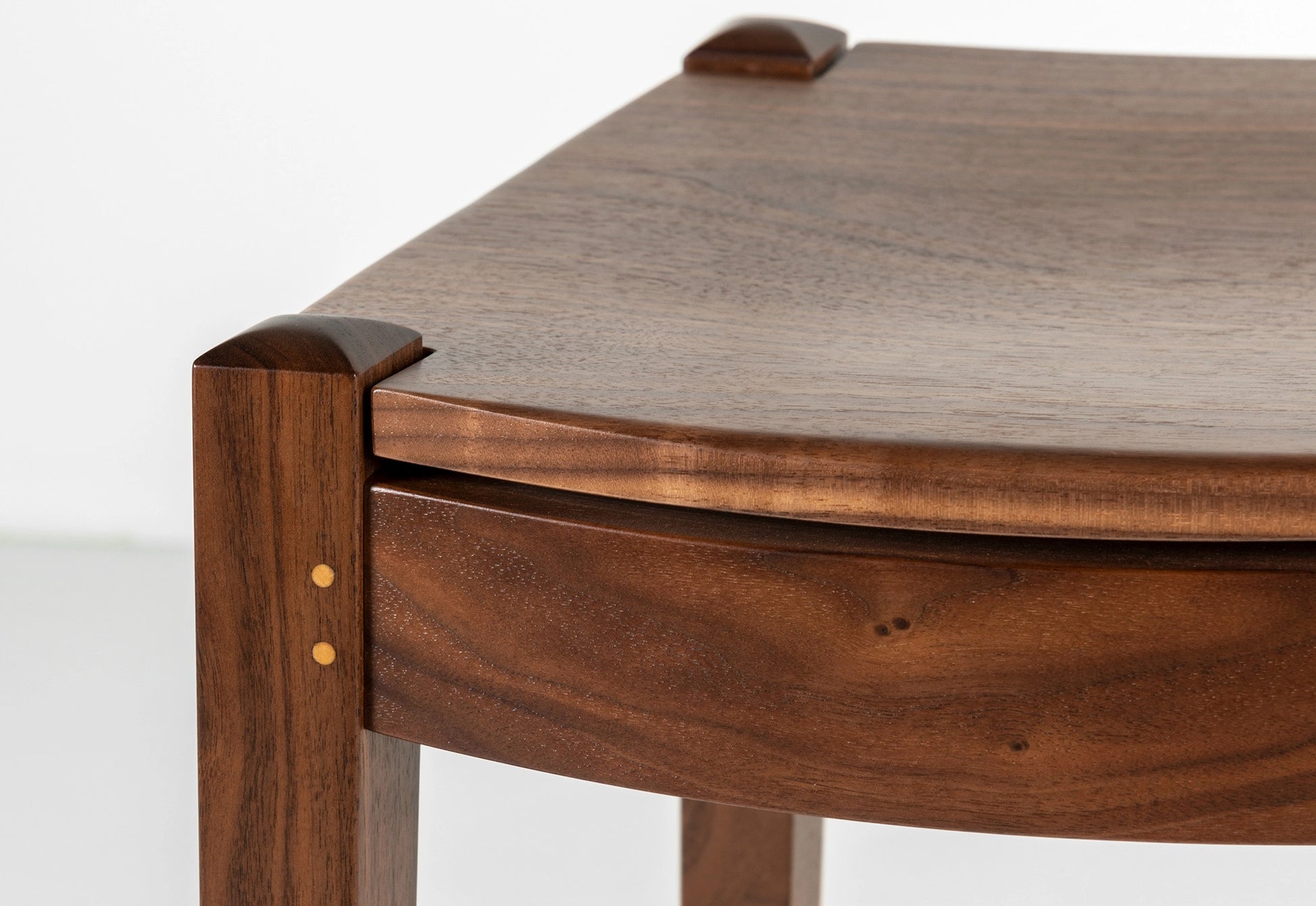 Close-up of a wooden chair with a white background