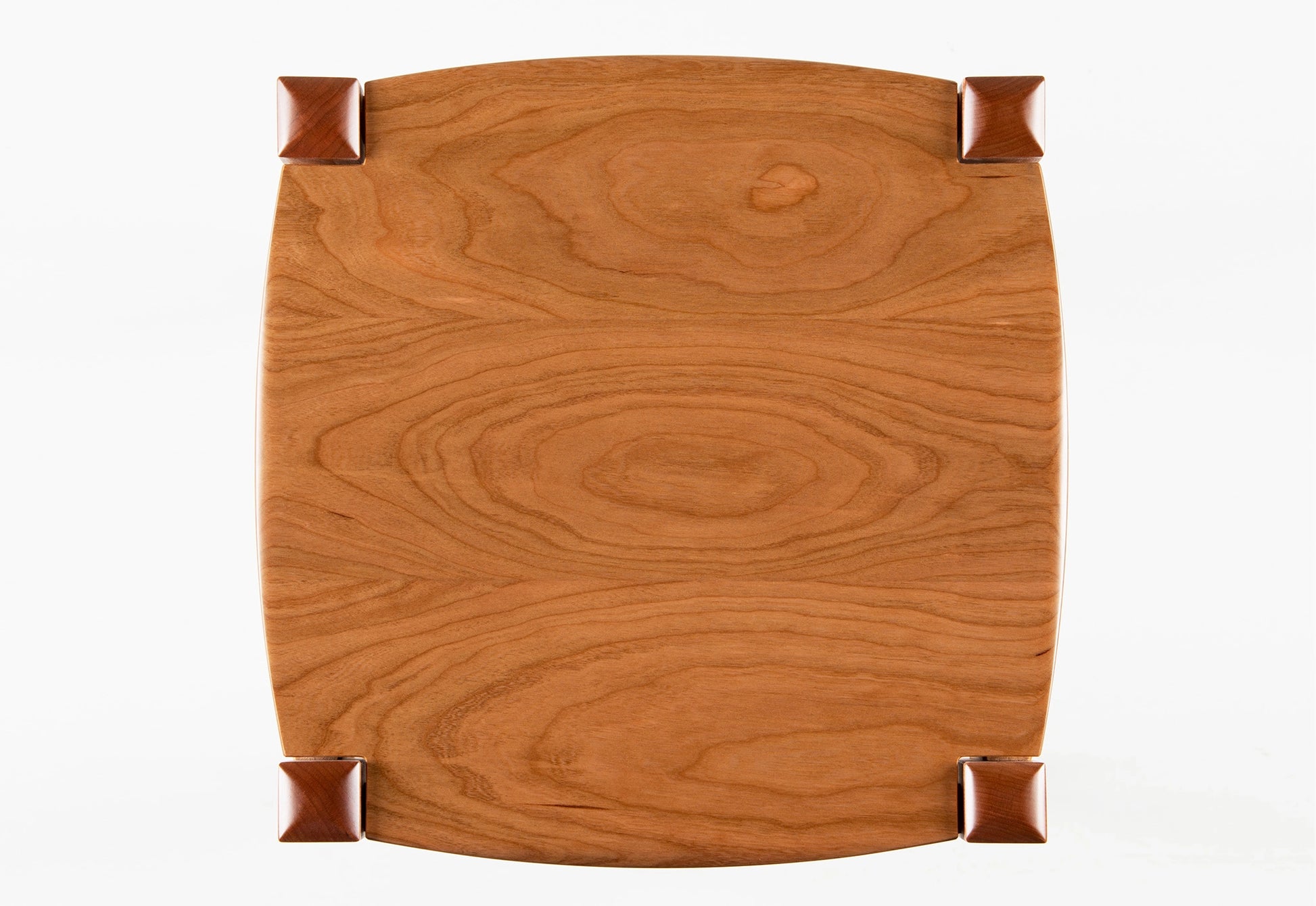 Wooden tray with a brown finish on a white background