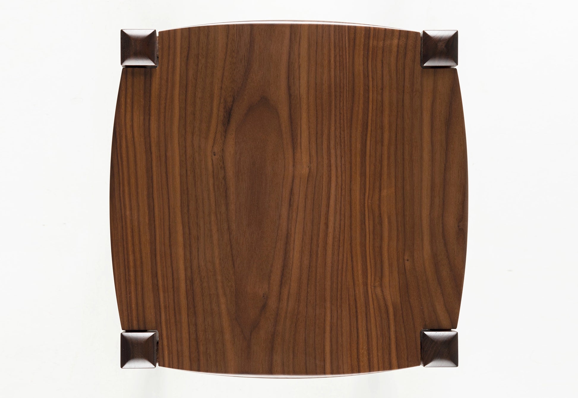 Wooden stool with a brown finish on a white background