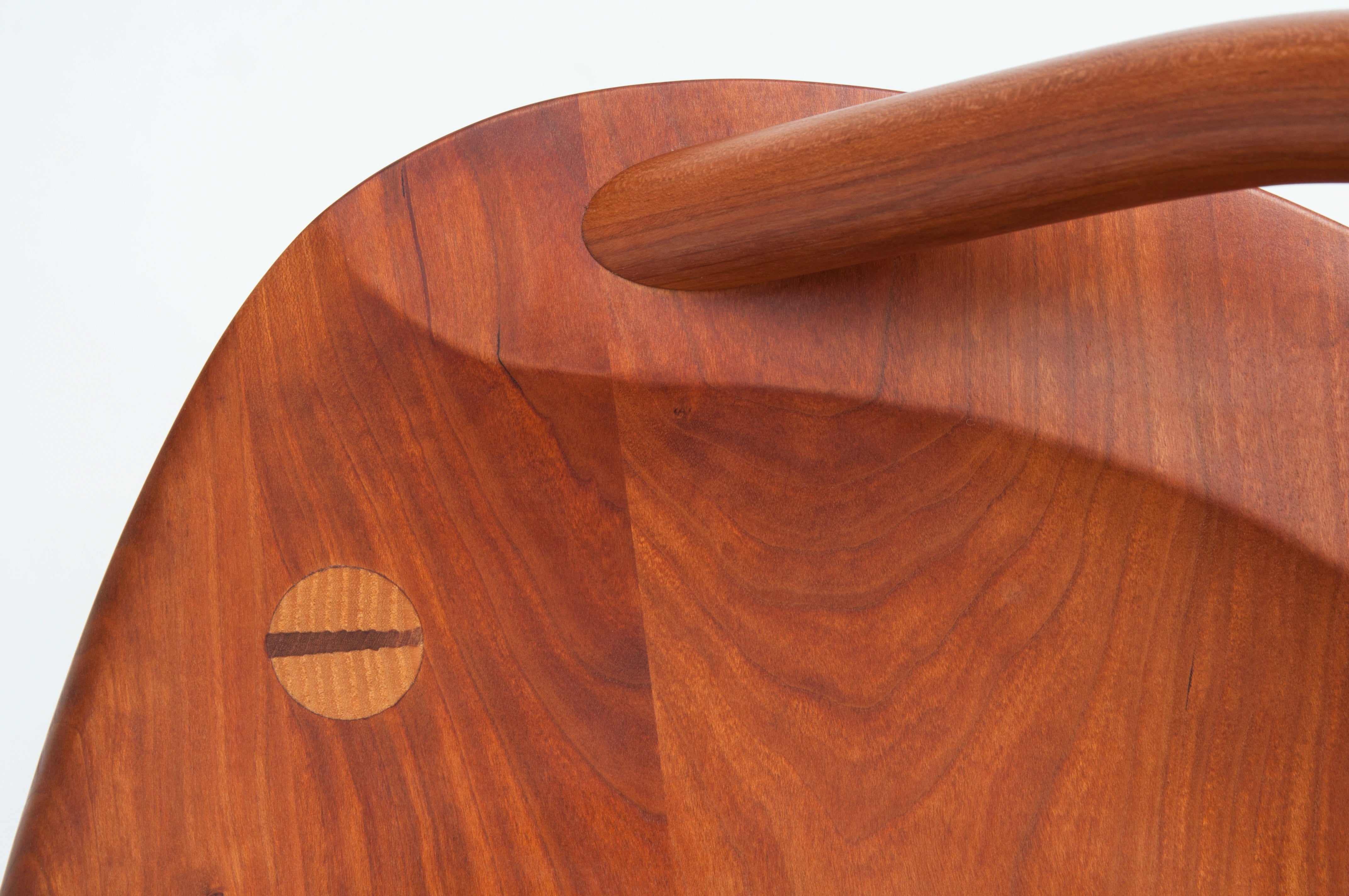 Close-up of a wooden stool on a white background
