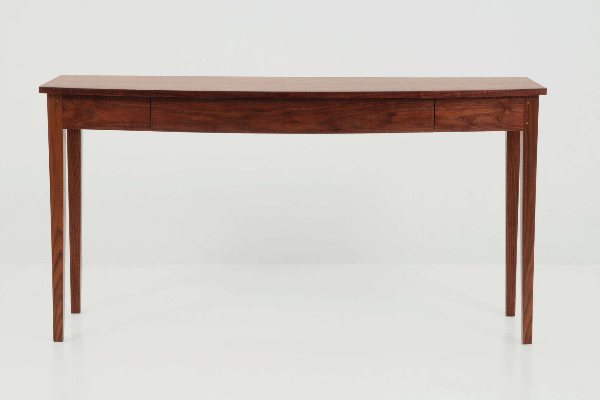 Wooden table with a light finish on a white background