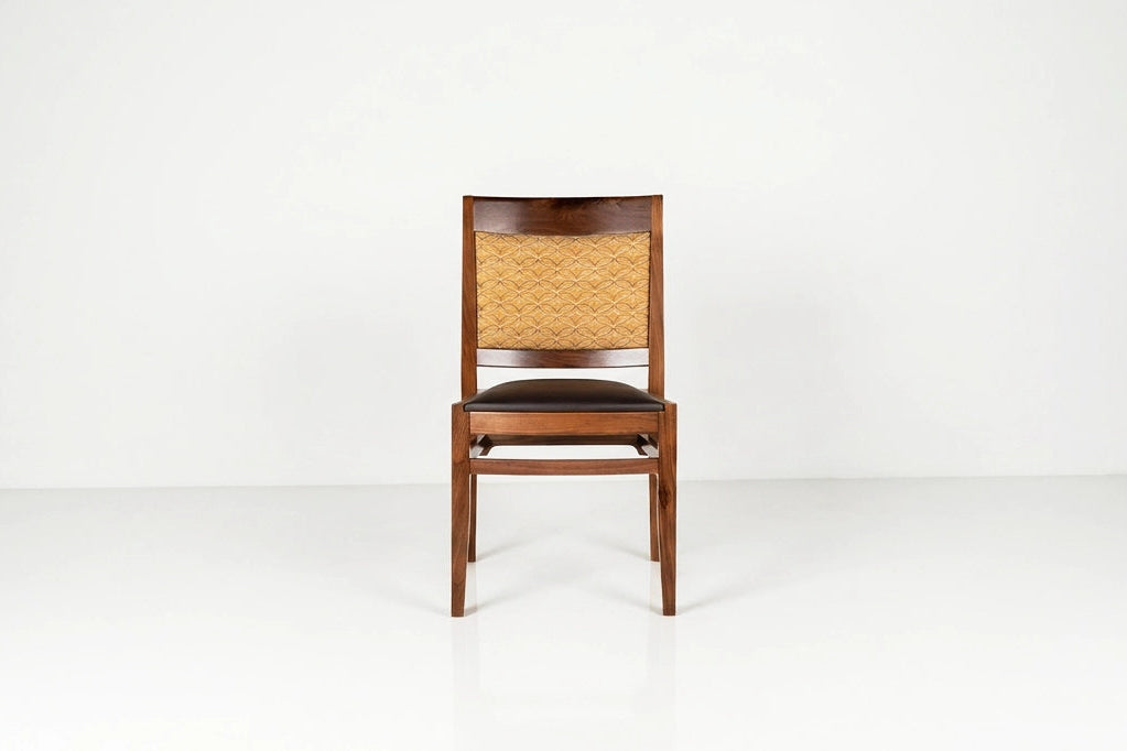 Wooden chair with woven backrest on a white background