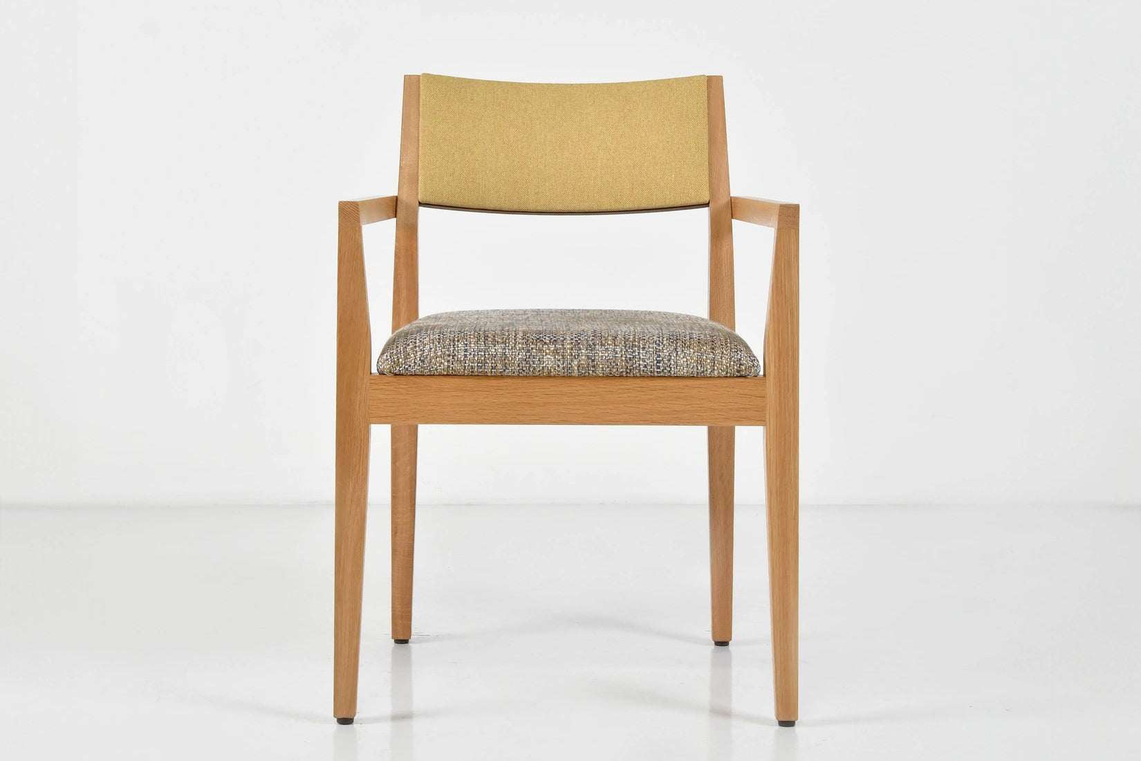 Chair with beige backrest and patterned seat on a white background