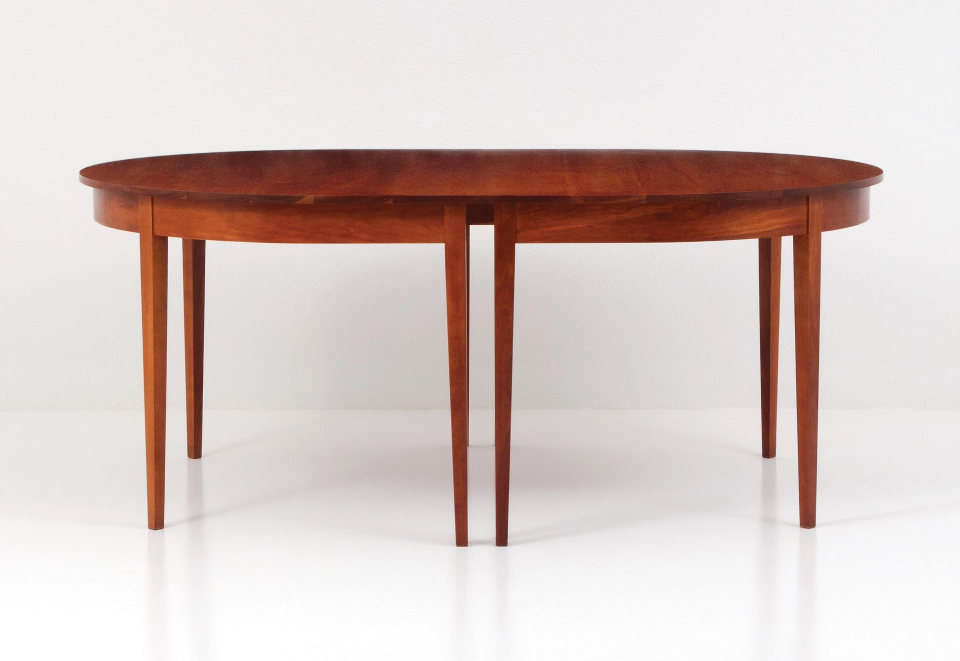 Wooden dining table on a white background