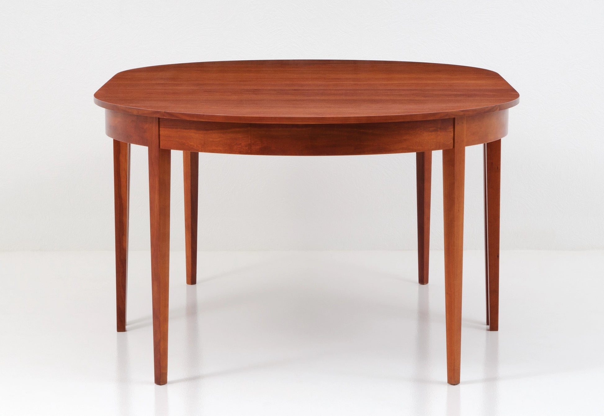 Wooden dining table on a white background