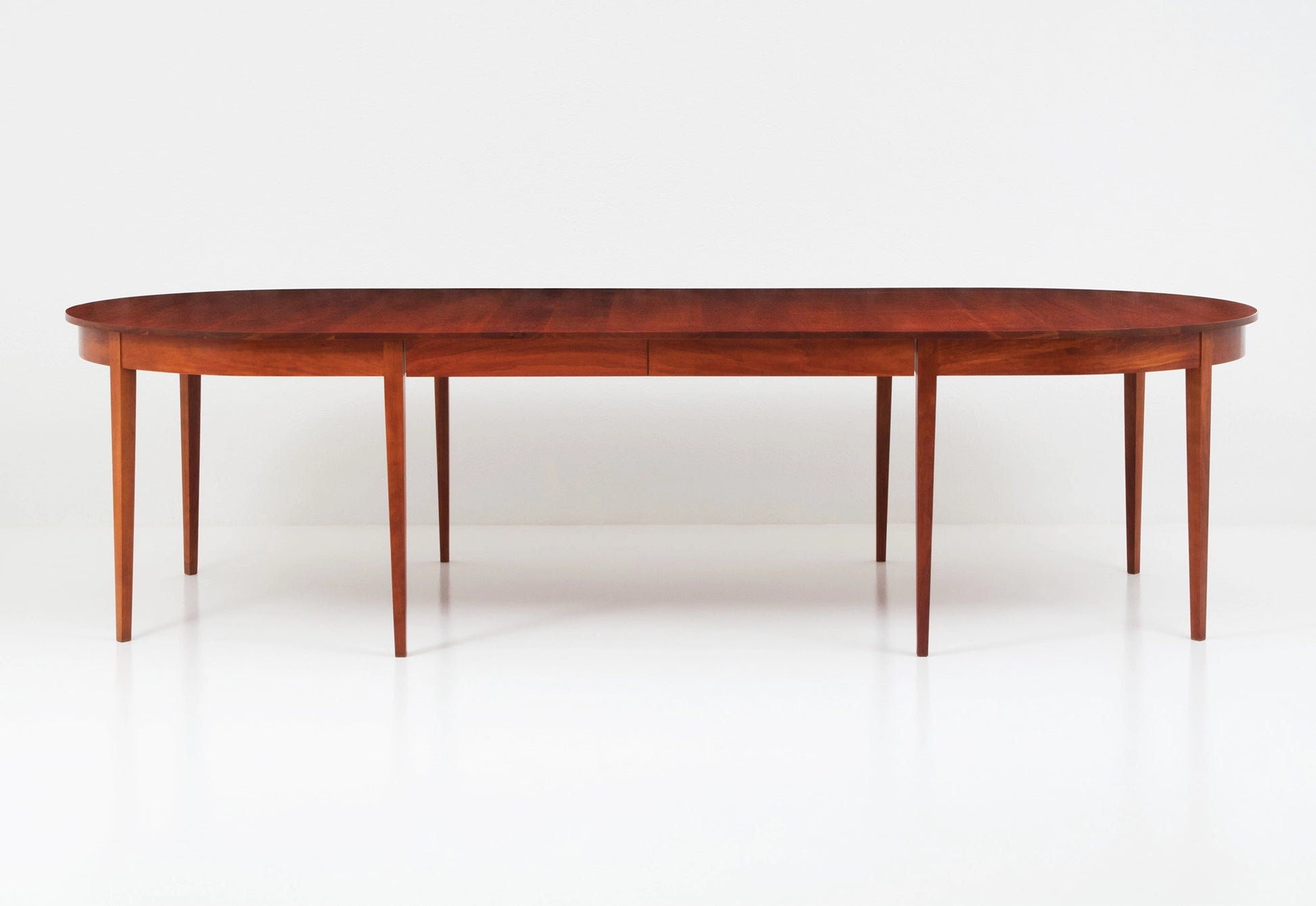 Wooden dining table on a white background