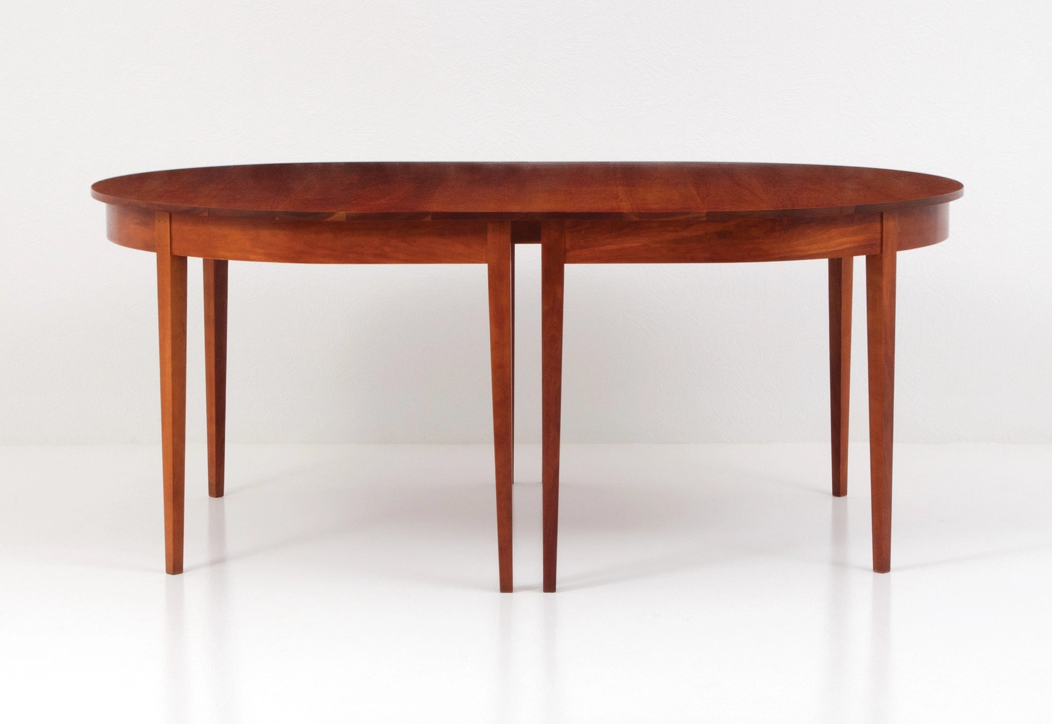 Wooden dining table on a white background