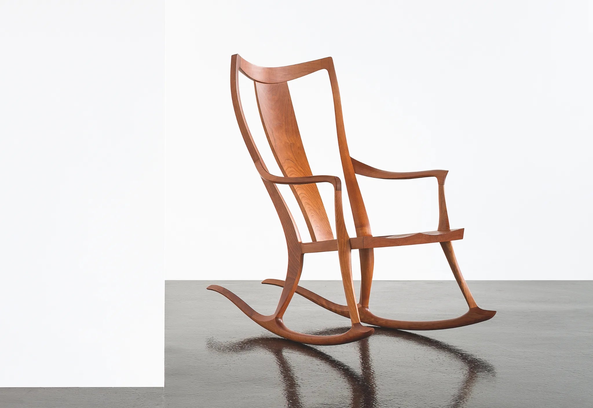Wooden rocking chair on a white background