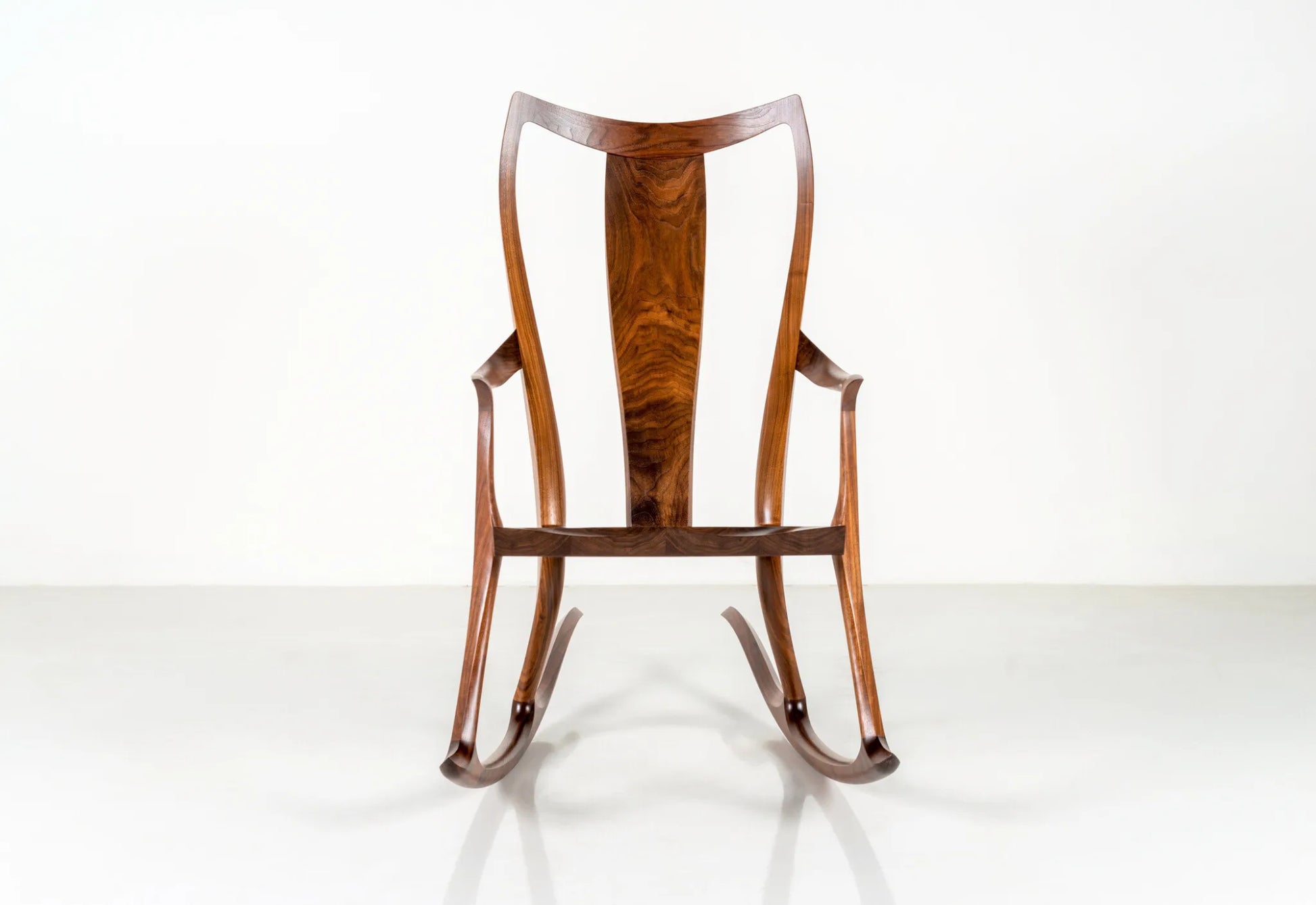 Wooden rocking chair on a white background