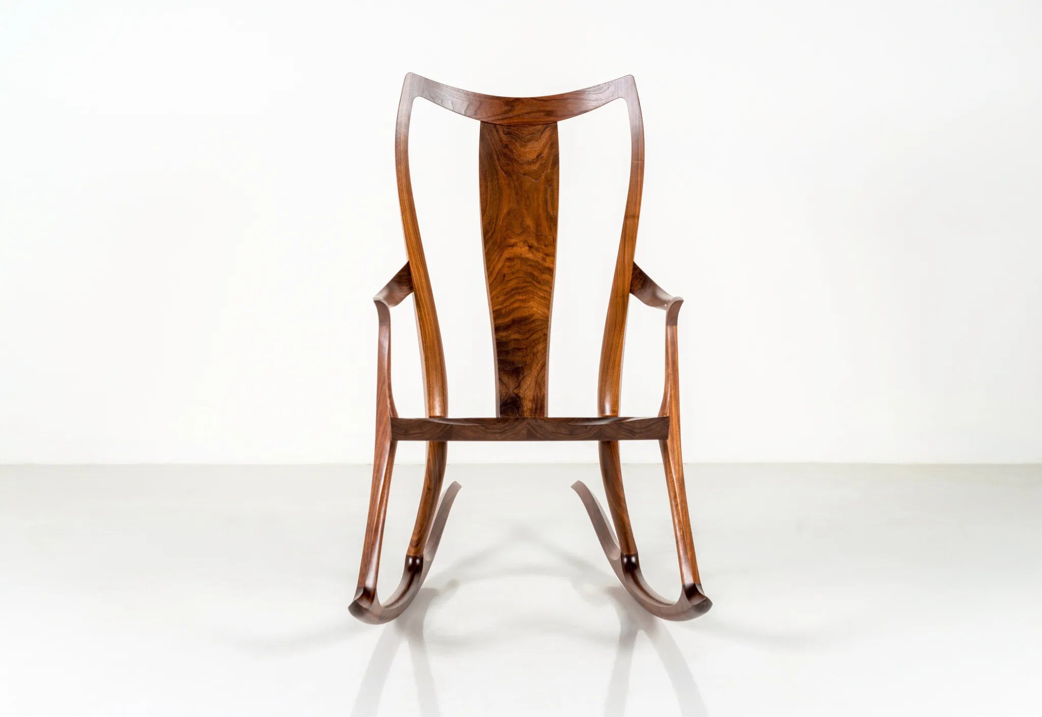 Wooden rocking chair on a white background