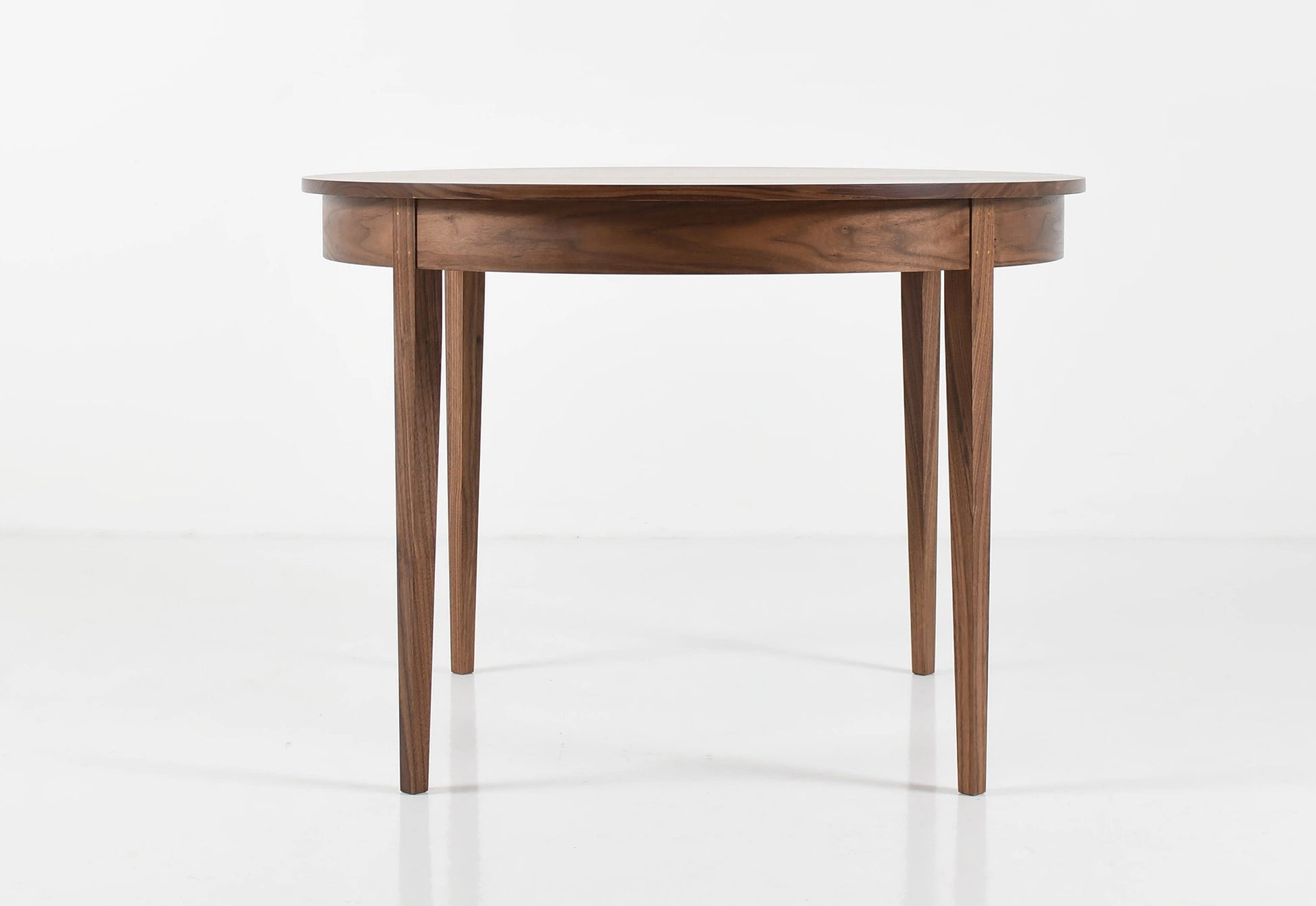 Wooden dining table on a white background