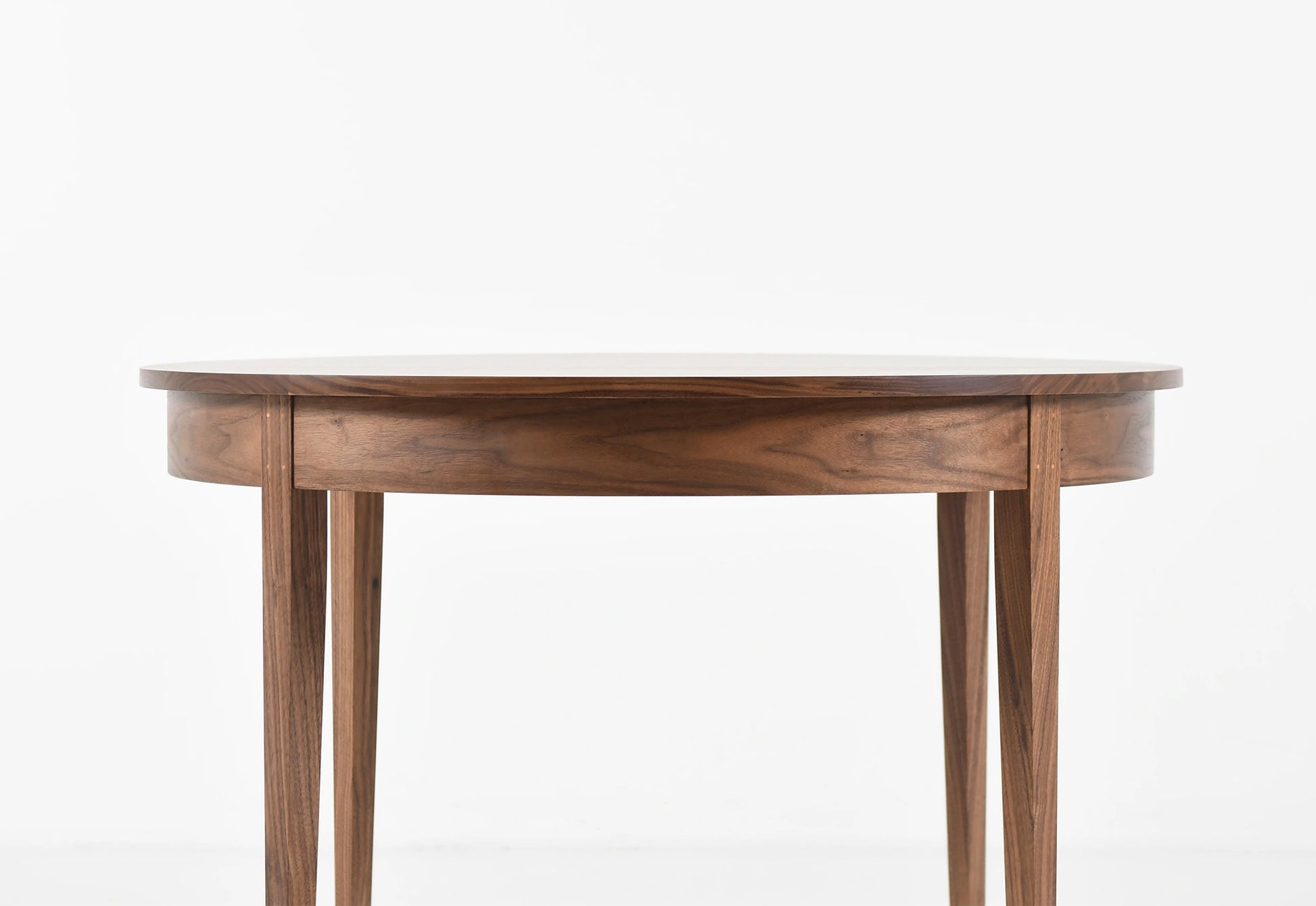 Wooden round table on a white background
