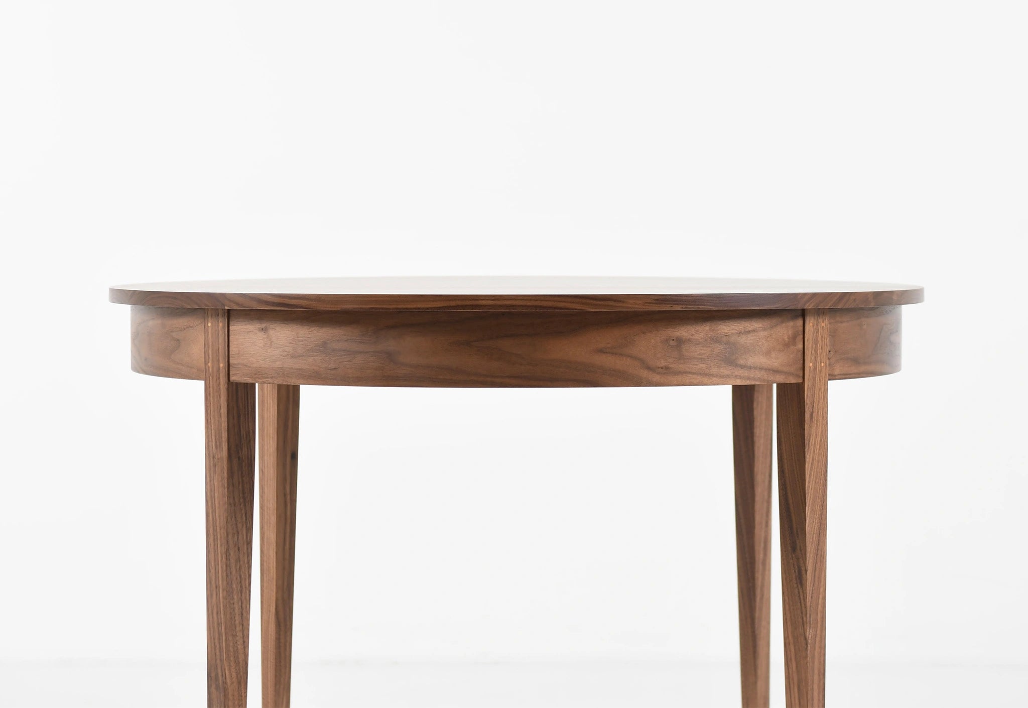 Wooden round table on a white background