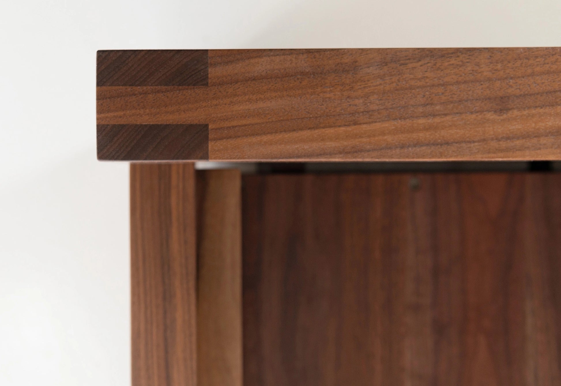 Detail of joinery on a walnut bed.
