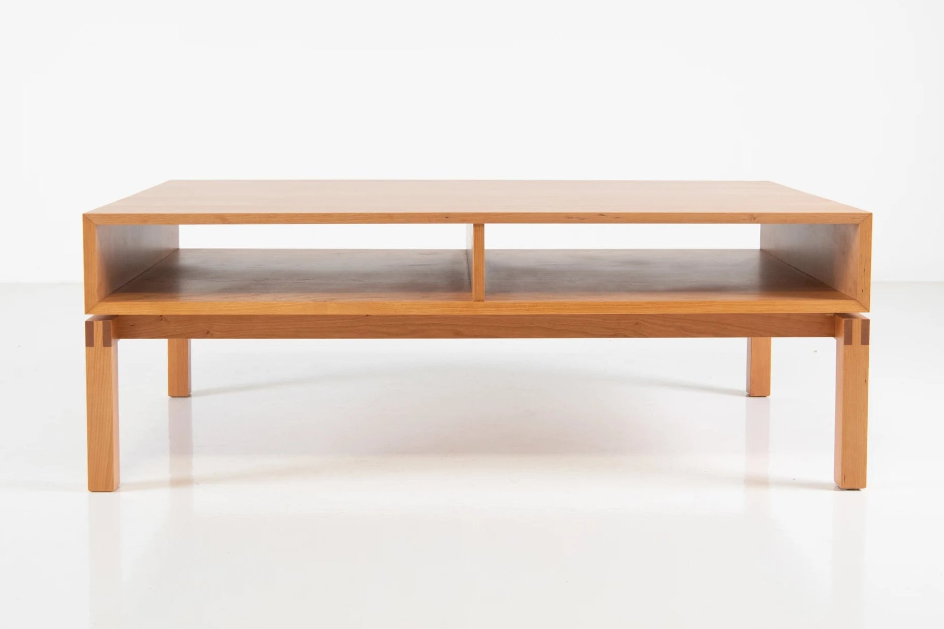 Wooden coffee table on a white background