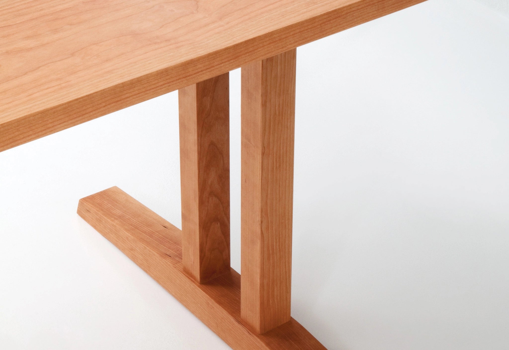 Wooden table with a minimalist design on a white background
