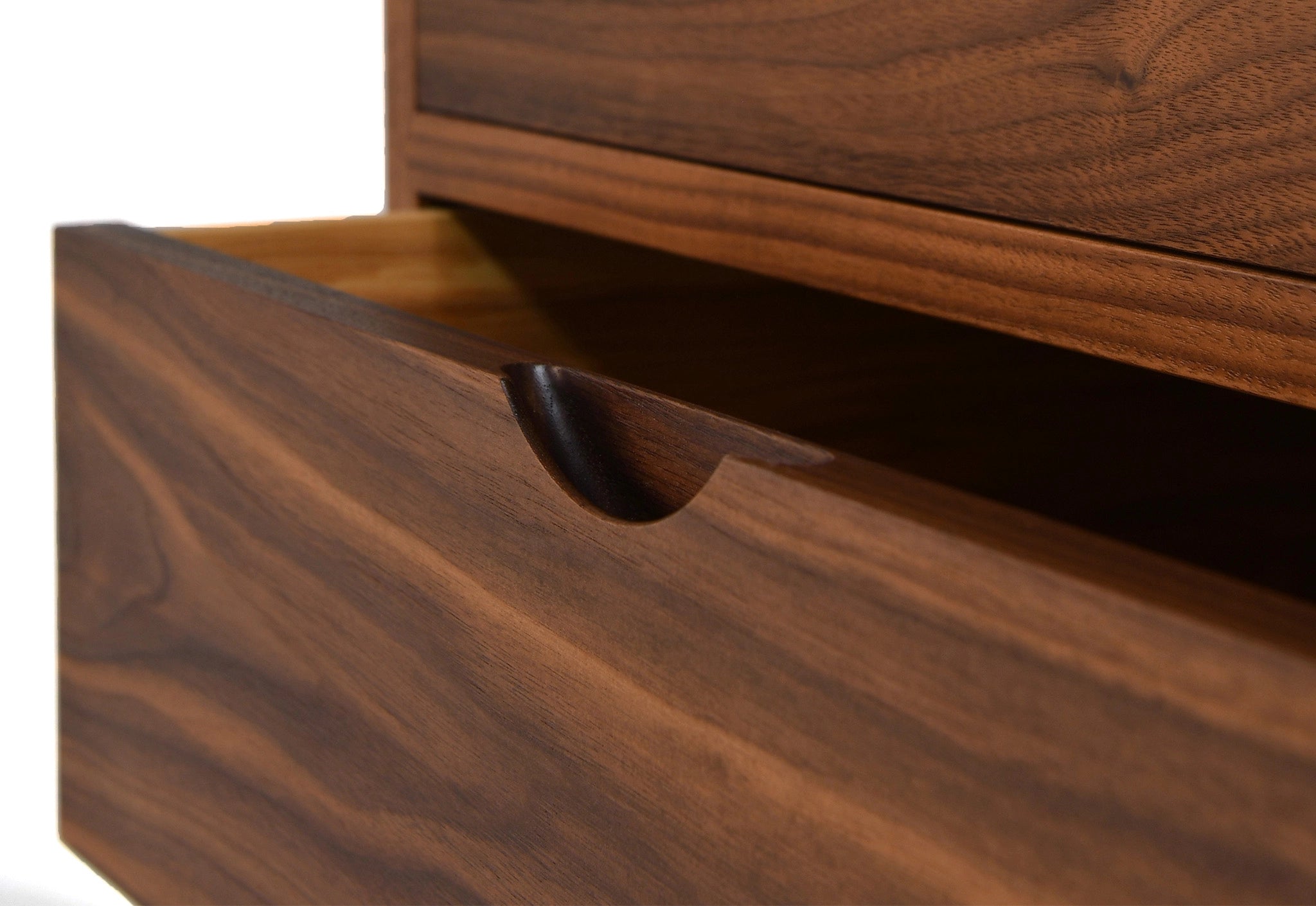 Close-up of a wooden drawer with a white background