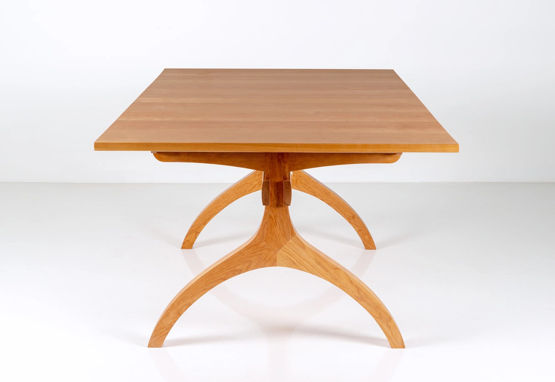 Wooden table with a minimalist design on a white background
