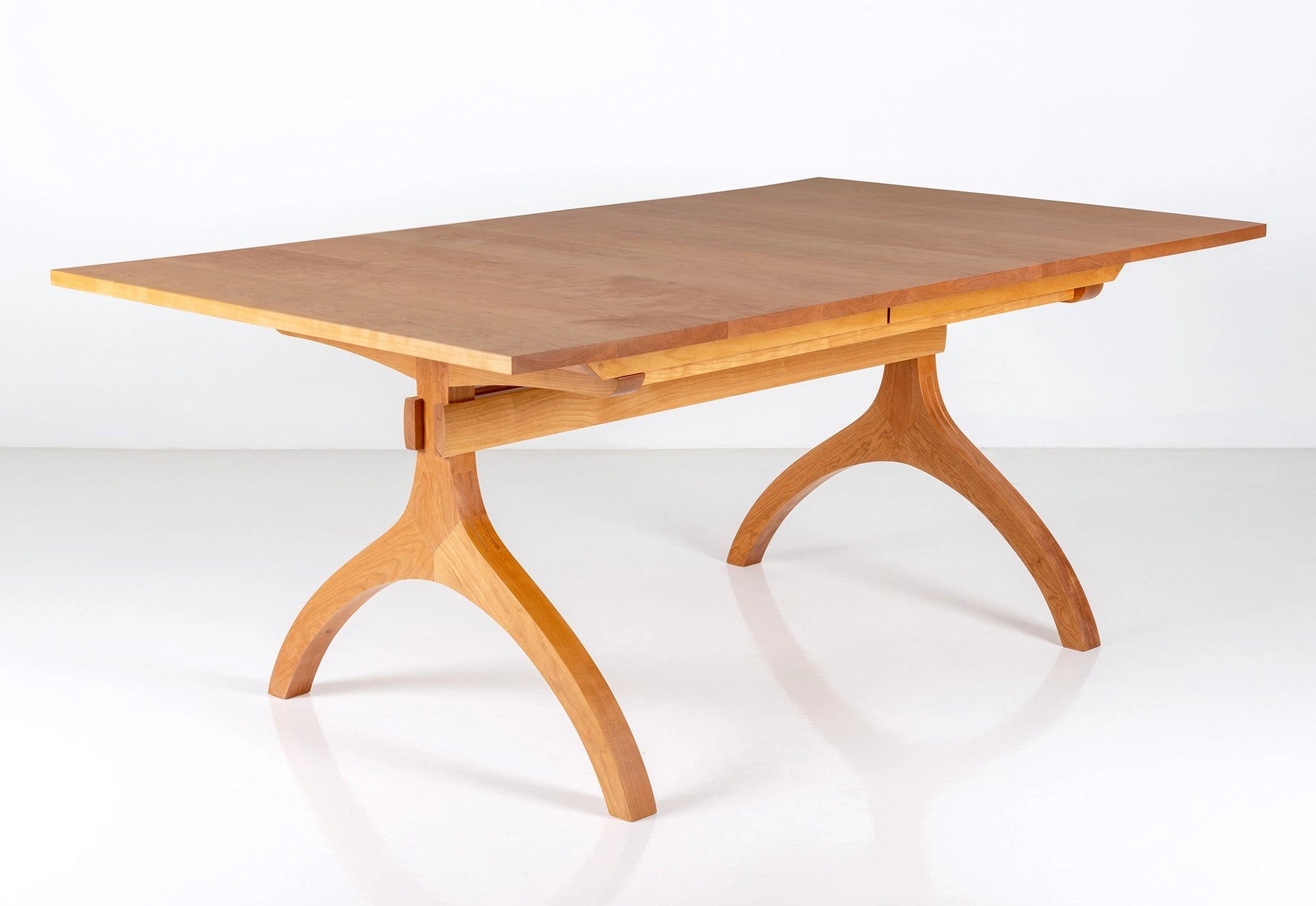 Wooden dining table with a white background