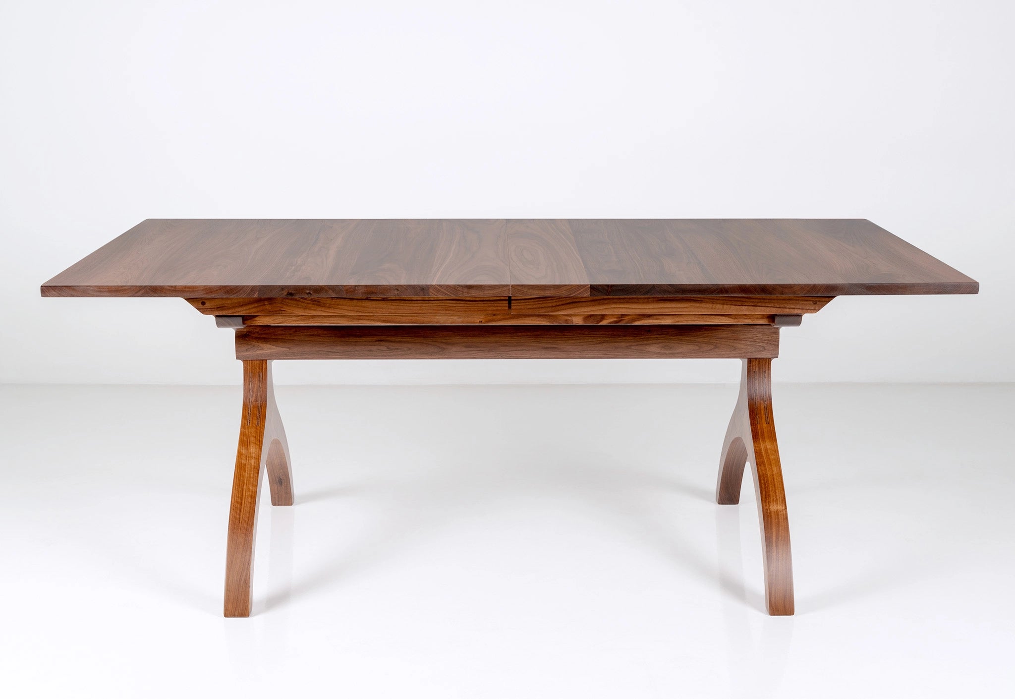 Wooden dining table on a white background