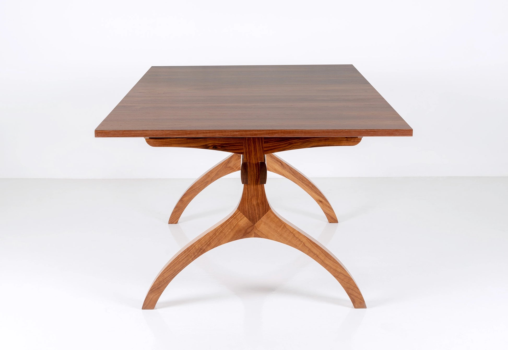Wooden dining table with a white background