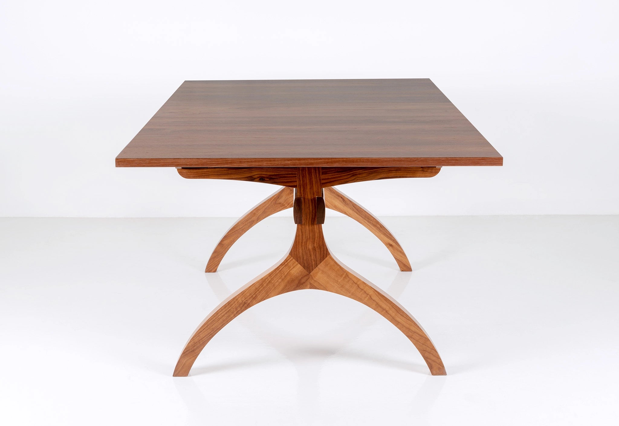 Wooden dining table with a white background