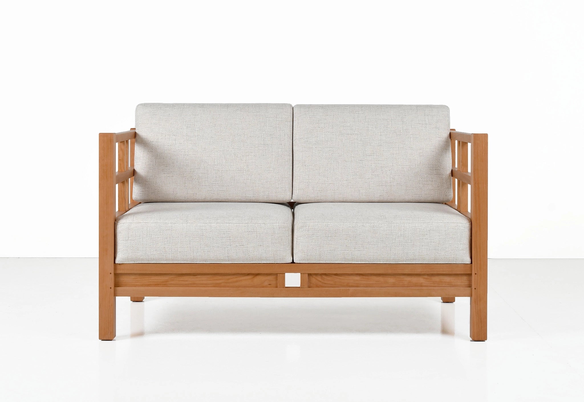 Wooden sofa with light gray cushions on a white background