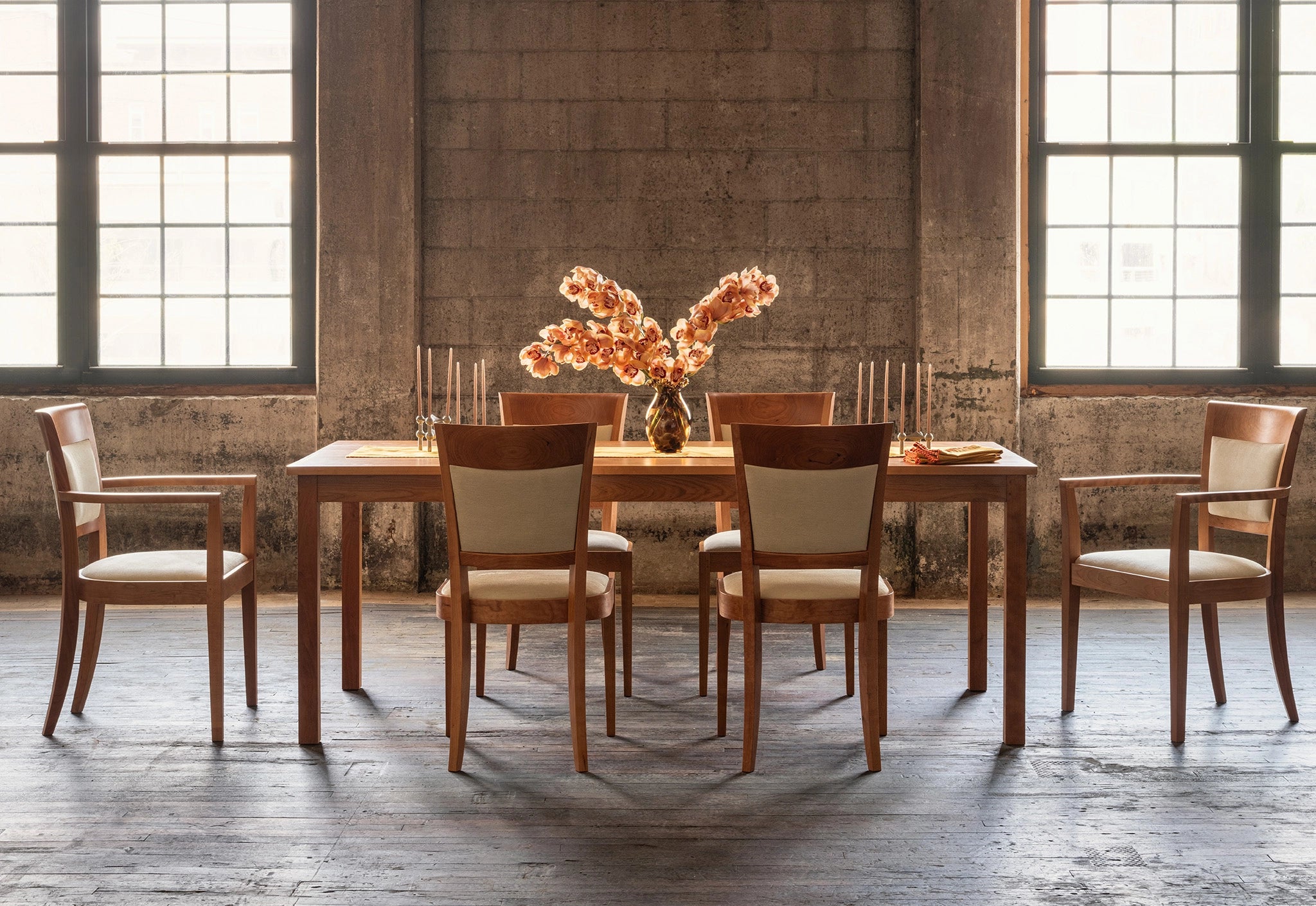 Dining room with wooden table and chairs in a rustic setting