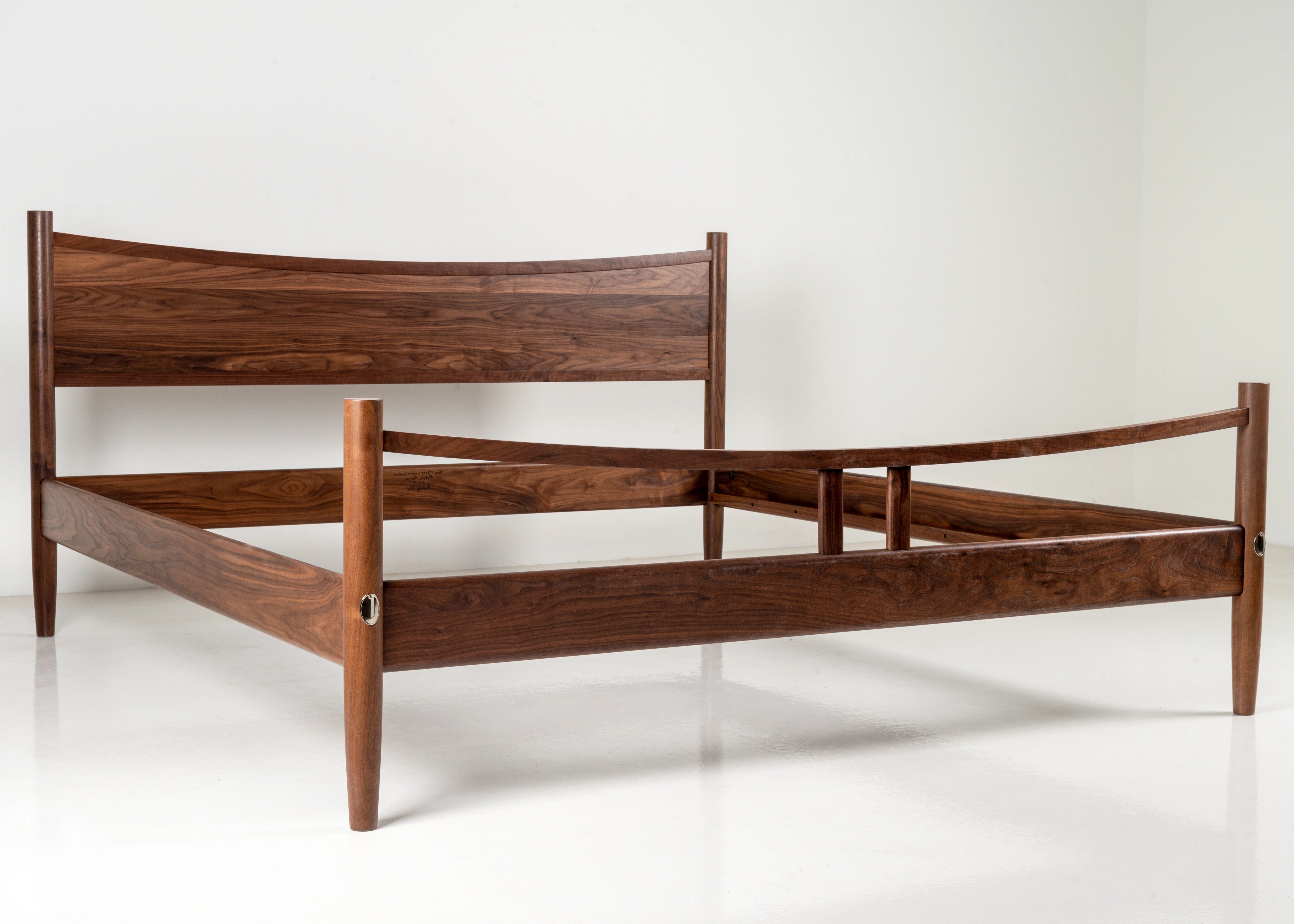 Wooden bed frame on a white background