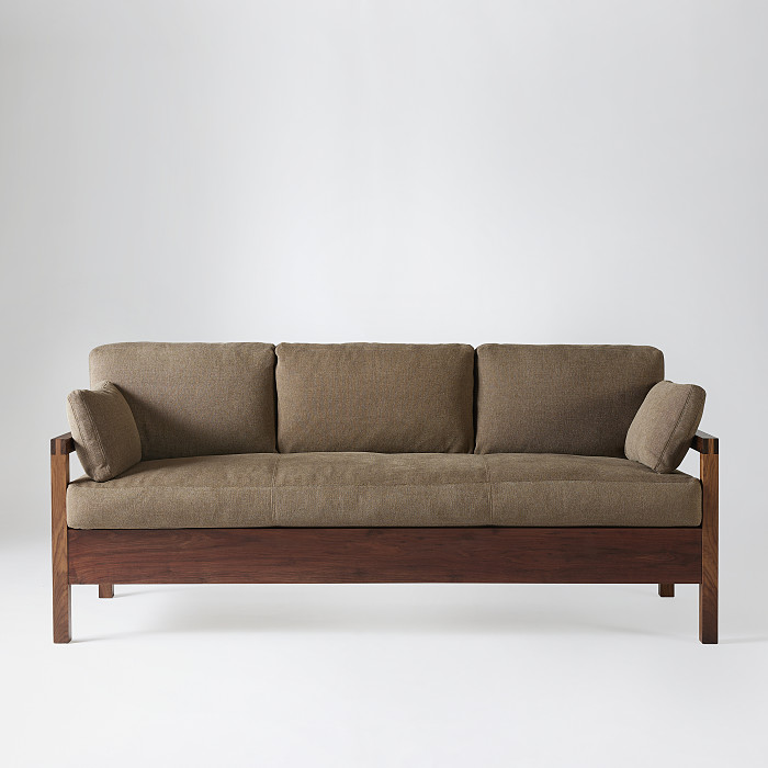 Front view of Studio Three place sofa in walnut with brown fabric upholstery