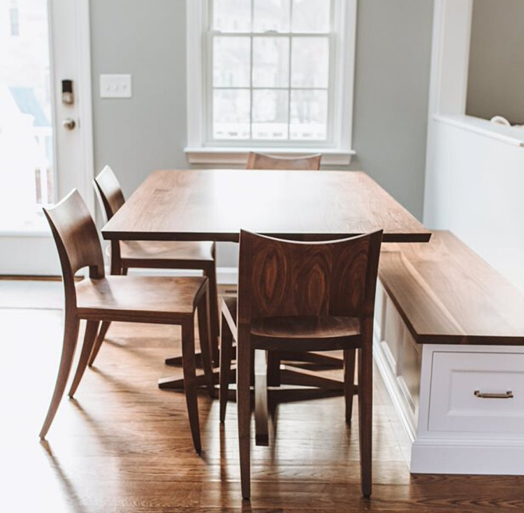 Dining nook with built in bench, walnut dining chairs and walnut trestle table