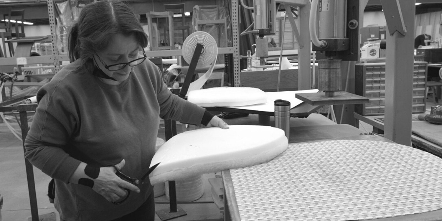 Woman cutting the cushion on a seat chair