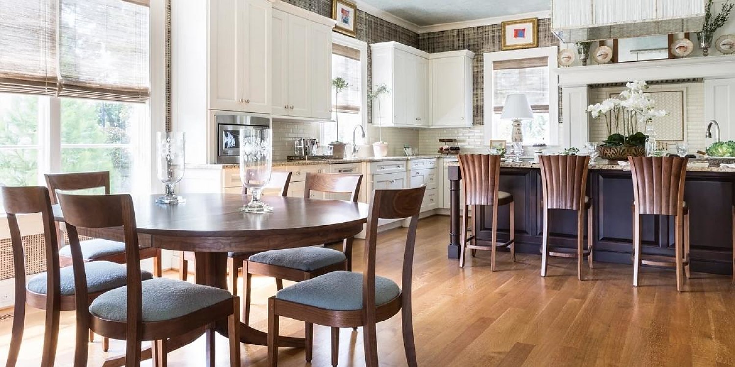 Open kitchen with island and aria stools with dining nook featuring harpswell chairs and georgetown table in walnut