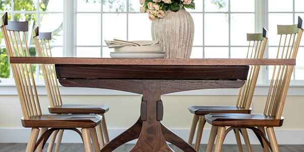 Wishbone Table and Eastward Side Chairs in walnut in dining room