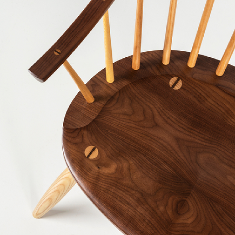 detail of walnut chair seat and arms