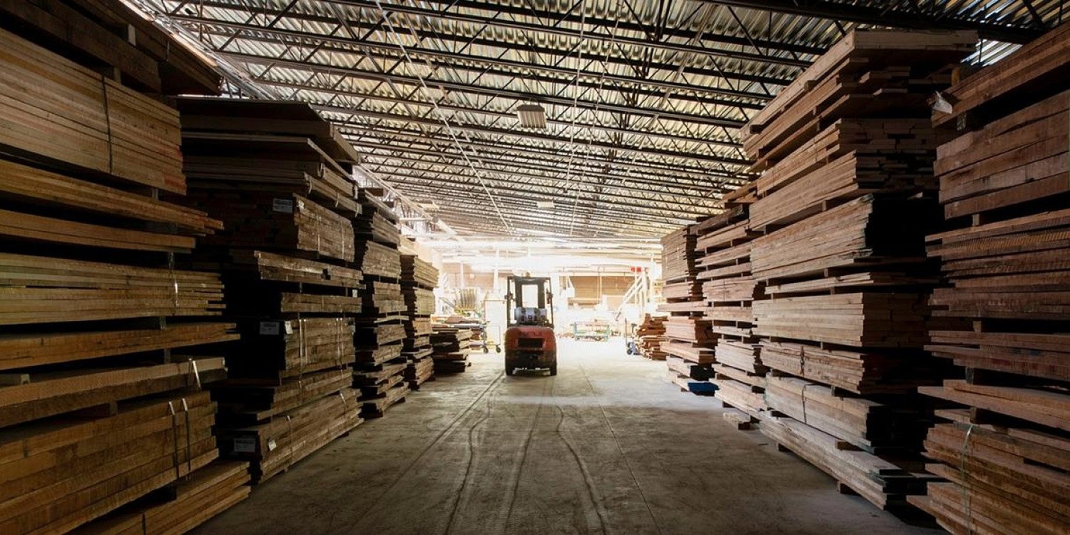 inside the rough mill with stacks of lumber