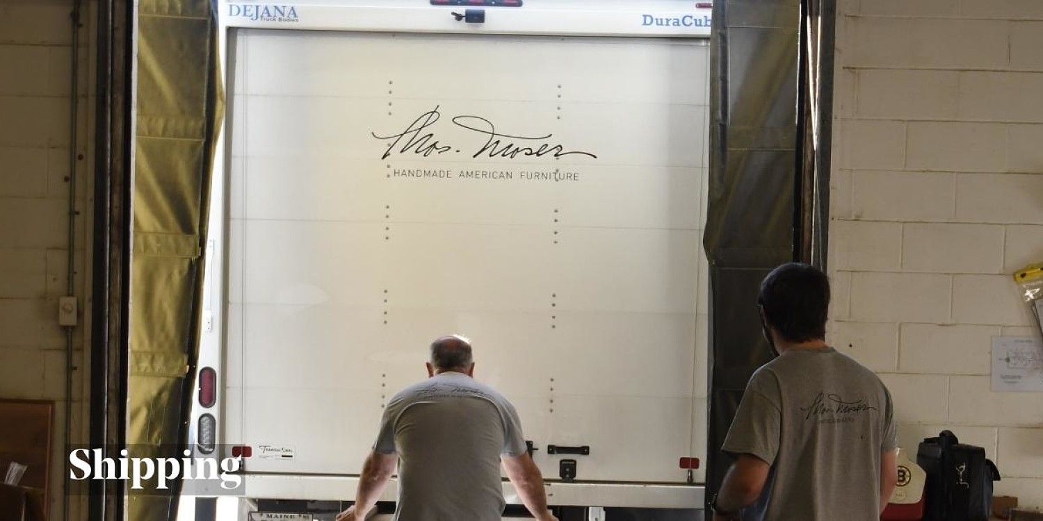 man loading back of truck